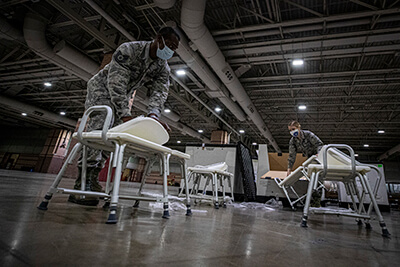 New Jersey Air National Guard members set up hospital equipment during the buildup of a field medical station at the Atlantic City Convention Center in Atlantic City, New Jersey, April 9.